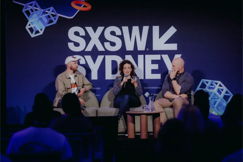 Panel on stage with SXSW Sydney as backdrop
